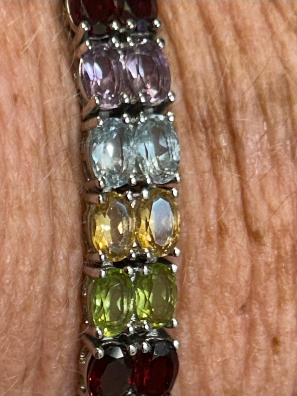 Semi-precious gemstone tennis bracelet set in sterling silver.